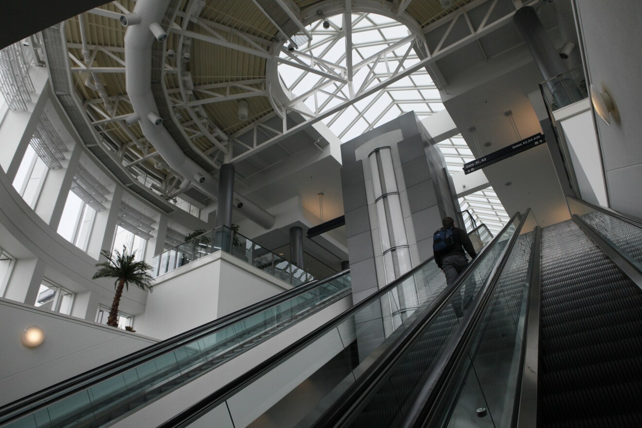 A passenger rides an escalator to terminal A at the Cincinnati/Northern Kentucky International Airport.